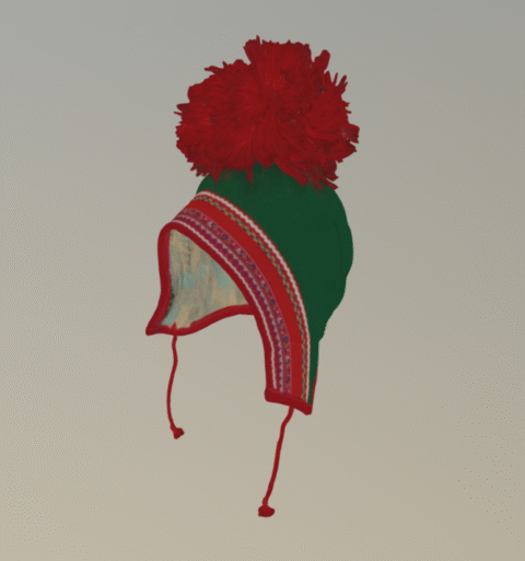 Päähine on vihreää verkaa ja kypärän mallinen, päällä punainen tupsu